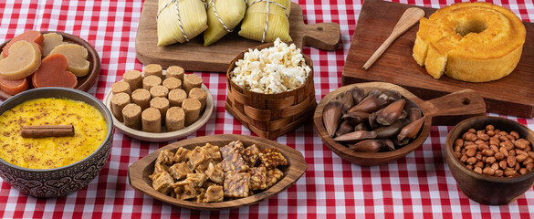 Typical brazilian june festival food over red plaid fabric. Festa junina