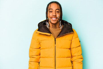 Young African American man isolated on blue background happy, smiling and cheerful.