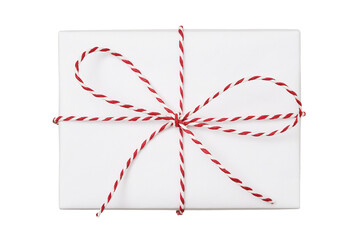 Christmas gift box wrapped in white paper with striped string bow isolated on white background