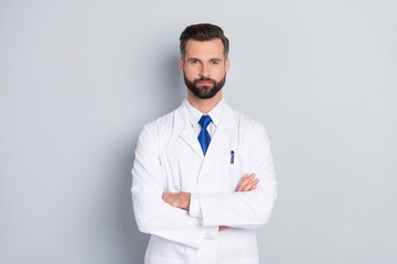 Portrait of attractive skilled smart experienced successful medic director professor folded arms isolated on grey color pastel background
