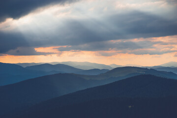 the light in the mountains breaks through the clouds Ukraine Carpathians