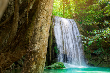 Fototapeta na wymiar Beautiful waterfall and emerald pool in tropical rain forest in Thailand...