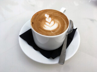 A cup of freshly brewed cappuccino served in a café