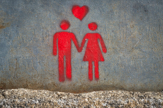 grafitti art of a couple with a heart, love concept.