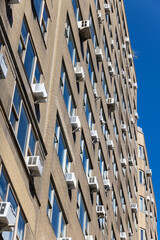 Many air conditioners installed at windows of residential buildings along Park Avenue in Midtown Manhattan on October 21, 2021 in New York City NY USA.