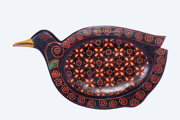 Application of batik in medium of small plates with wood material looks luxurious. Widely used as home interior decoration.