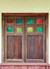 Old historical wood window on wall. Ancient living exterior