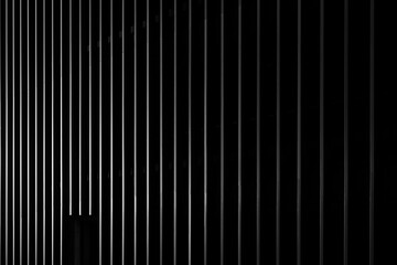 Black striped facade. Dark background