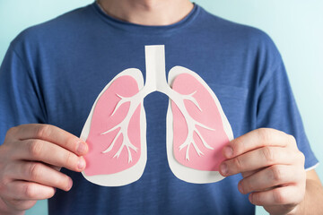 Man holding lungs decorative model. World tuberculosis TB day, pneumonia, respiratory diseases...