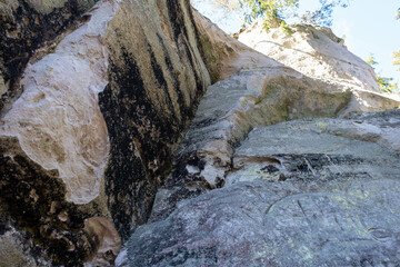 Large sandstone cliffs of Sietiniezis on the shore of the river Gauja in Latvia. tourist nature trail for hiking with wooden stairs