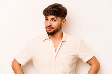 Obraz premium Young hispanic man isolated on white background unhappy looking in camera with sarcastic expression.