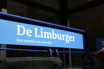 Sittard, Netherlands - March 25. 2022: Closeup of magazine rack with logo lettering of dutch daily newspaper de limburger