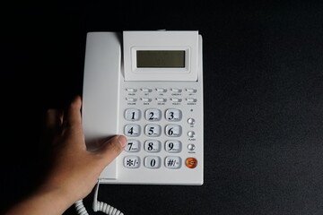 Telephone on the office desk dark