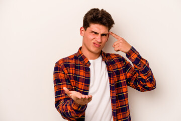 Fototapeta premium Young caucasian man isolated on white background holding and showing a product on hand.