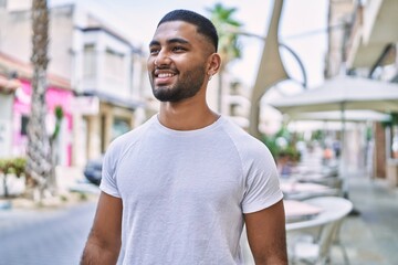 Fototapeta premium Young middle east man smiling happy standing at the city.