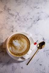 cappuccino with a pattern top view. coffee in a white cup.