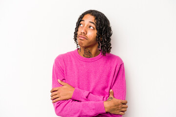 Young African American man isolated on white background dreaming of achieving goals and purposes