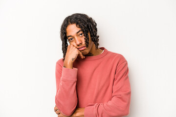 Young African American man isolated on white background tired of a repetitive task.