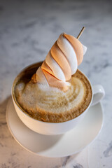 cappuccino with sweet marmalade on the background