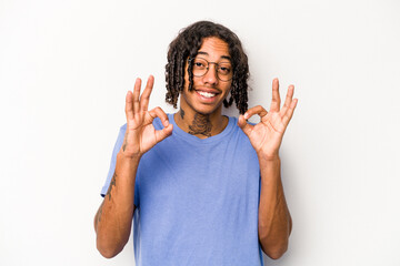 Young African American man isolated on white background cheerful and confident showing ok gesture.
