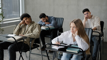 Young students employees workers unmotivated staff sitting in classroom listening boring lecture...