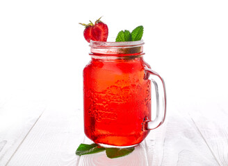 Cold strawberry lemonade in mason jar isolated