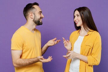 Young smiling cheerful happy cool couple two friends family man woman together in yellow casual...