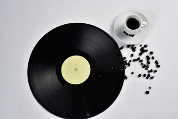 vinyl record object retro for decoration, cup of coffee beside isolated on white background