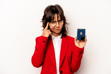 Young informatic hispanic woman isolated on white background pointing temple with finger, thinking, focused on a task.