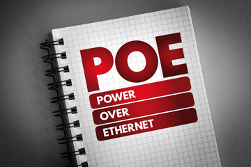 PoE - Power Over Ethernet acronym on notepad, technology concept background