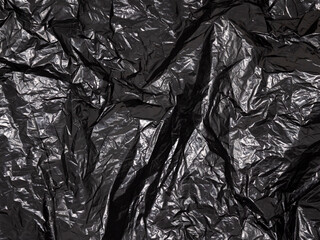 crumpled plastic bag. wrinkled black plastic bag