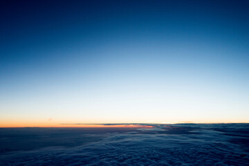 Fototapeta na wymiar Dark clouds from airplane window