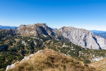 Fototapeta na wymiar Panoramic view on the mountain peaks of the Hochschwab Region in Upper Styria, Austria. Sharp summits of Ebenstein and Hinterer Polster, Alps in Europe. Climbing tourism, wilderness. Concept freedom