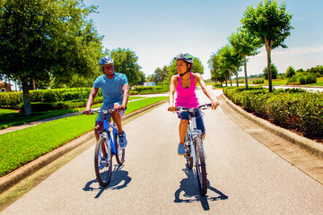 Young African American couple enjoying leisurely cycle ride
