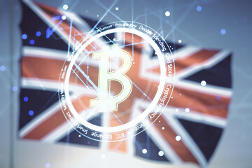 Virtual Bitcoin hologram on flag of Great Britain and sunset sky background. Multiexposure