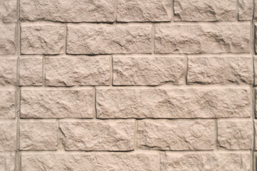 The surface of rough decorative sand-colored plaster