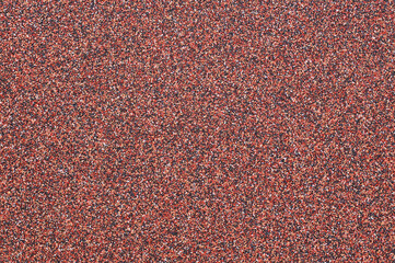 The surface of rough decorative sand-colored plaster