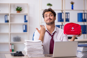 Young male employee feeling bad at workplace