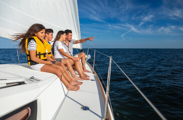 Young Latin American family sailing on luxury yacht