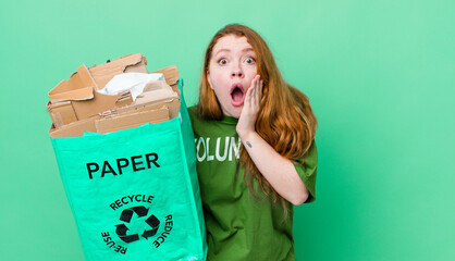 red head pretty woman feeling shocked and scared. recycling concept