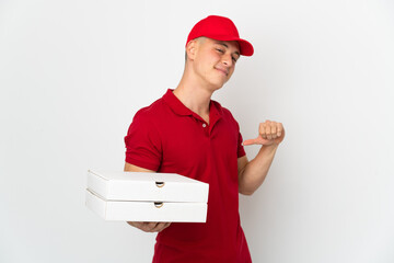 Pizza delivery man with work uniform picking up pizza boxes isolated on white background proud and self-satisfied