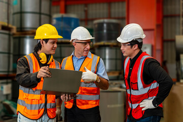 Team of diversity worker inspecting inside the steel manufacturing factory while listening to...