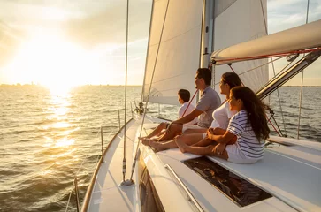 Fototapeten Family travel adventures on luxury yacht at sunset © Spotmatik