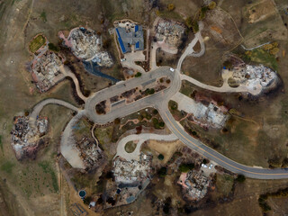 remnants of burned homes from the destructive urban Marshall wildfire in Louisville Colorado due to...