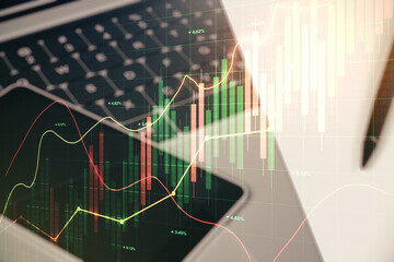Double exposure of abstract creative financial diagram on modern laptop background, banking and accounting concept