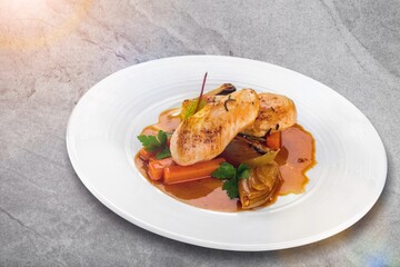 Roast chicken meat with vegetable on plate