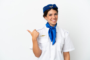Airplane stewardess caucasian woman isolated on white background pointing to the side to present a product
