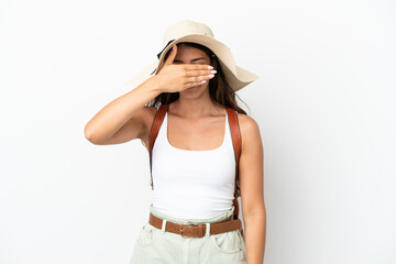 Obraz na płótnie Canvas Young caucasian woman wearing a Pamela in summer holidays isolated on white background covering eyes by hands. Do not want to see something