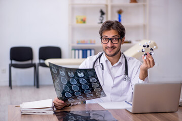 Young male doctor radiologist working in the clinic