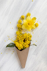 Spring still life with mahonia flowers and narcissus